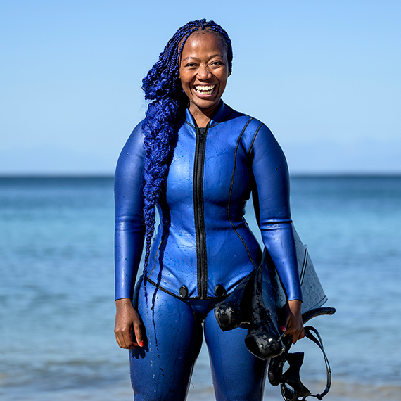 Zandile Ndhlovu aims to change Africa’s narrative about who belongs in the ocean and to diversify representation in ocean-facing careers, sports, and recreation. Her dream of eradicating the fear of deep waters by exposing kids to the ocean became a reality when she founded The Black Mermaid Foundation to create a space where fear expands into love.